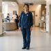 Healthcare professional wearing medical scrubs with a lightweight scrub jacket